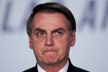 Brazil’s President Jair Bolsonaro attends a signing ceremony for 13.2 billion reais in contracts for electricity transmission lines, at the Planalto Palace in Brasilia